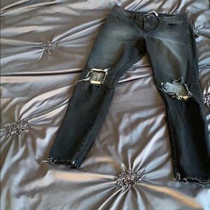 Black washed blue jeans, with rips!